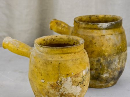 Two antique French cooking pots with one handle and yellow glaze Supply