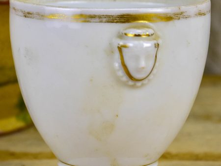 Antique French earthenware cup with face handles and gold trim Discount