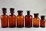 Collection of six amber pharmacy jars with lids - 19th Century on Sale