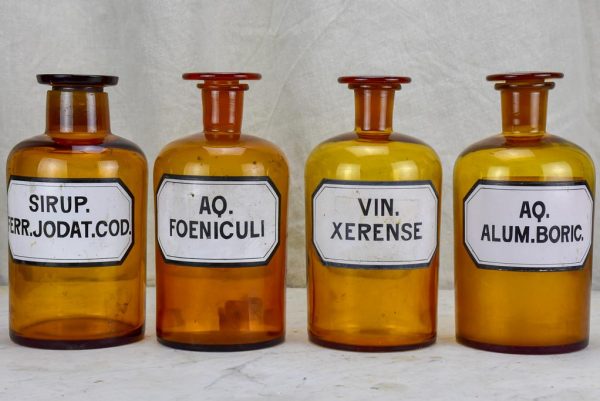 Four antique French apothecary jars with original glass lids - amber Hot on Sale