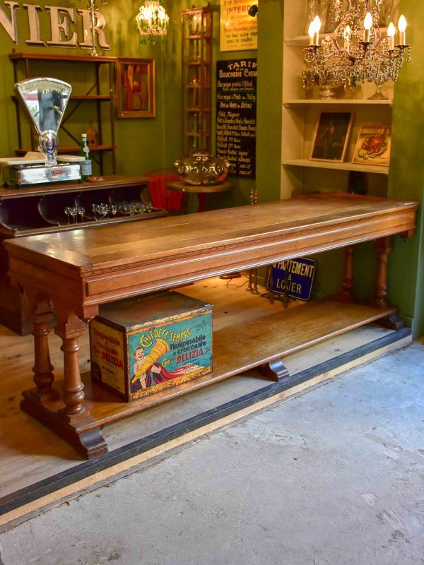 Antique French oak drapery table from a silk boutique Supply