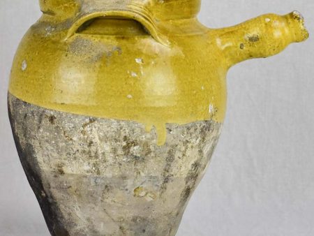 Early 19th Century French cooking clay pot with yellow glaze and handle Sale