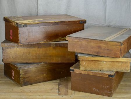 Collection of six large antique wooden boxes from a fabric boutique Fashion