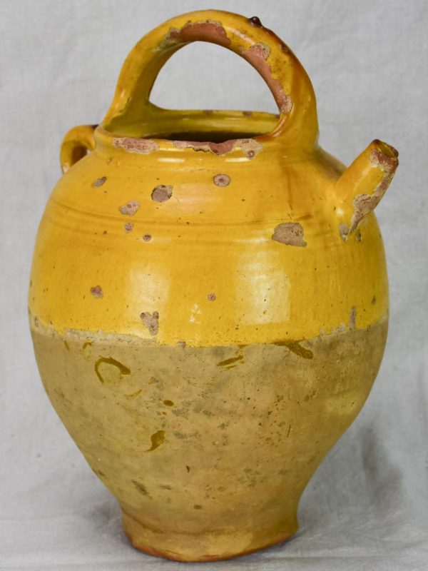 Antique French water cruche with yellow glaze Online