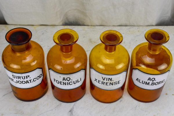 Four antique French apothecary jars with original glass lids - amber Hot on Sale