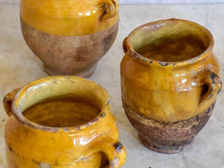 Collection of three very small antique French confit pots with ochre glaze Supply