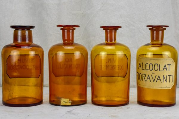 Four antique French apothecary jars with original glass lids - amber Hot on Sale