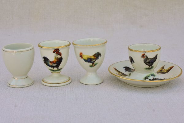 Four 1920 s French porcelain egg cups with chicken and rooster transfers Online now