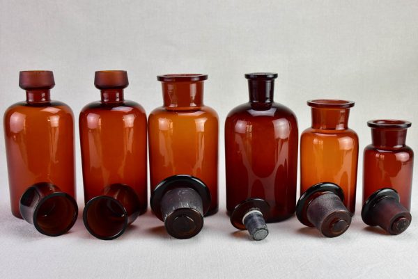 Collection of six amber pharmacy jars with lids - 19th Century on Sale