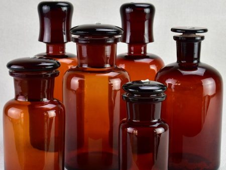 Collection of six amber pharmacy jars with lids - 19th Century on Sale