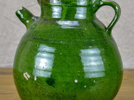 Early 20th Century French water jug with green glaze on Sale