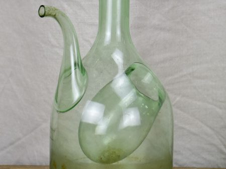 Antique French glass pouring bottle on Sale