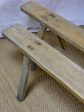 Pair of rustic antique French benches with splayed feet For Sale