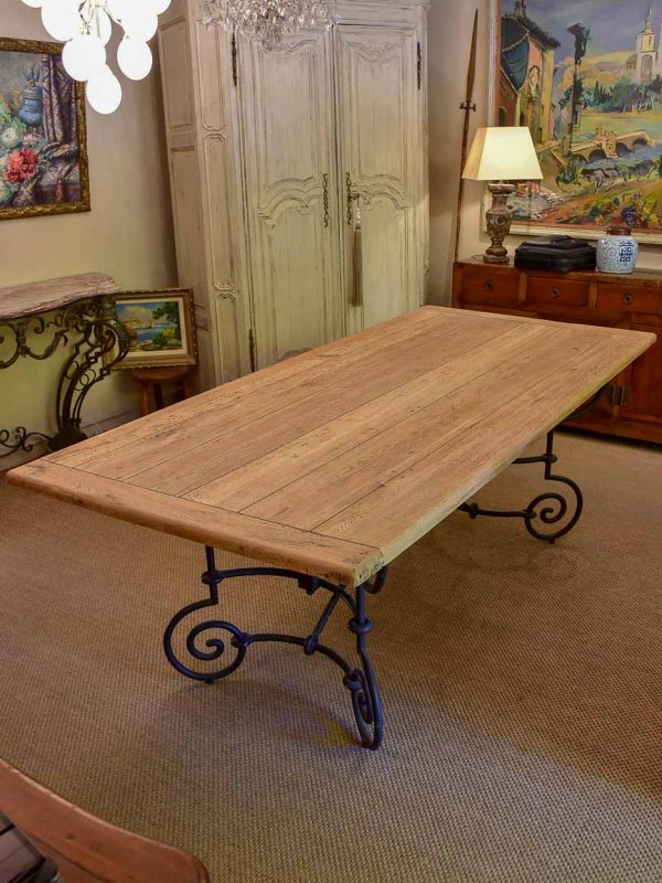 Antique French oak dining table with iron base For Sale