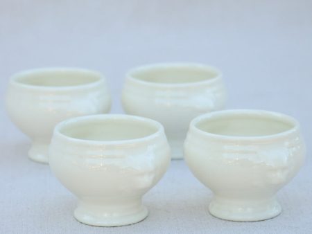 Four miniature earthenware cream bowls Online