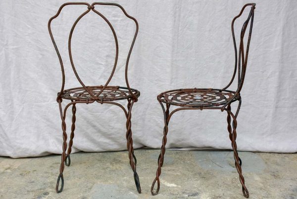 Pair of pretty black antique French garden chairs branded Vachon Discount