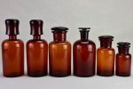 Collection of six amber pharmacy jars with lids - 19th Century on Sale