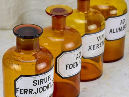 Four antique French apothecary jars with original glass lids - amber Hot on Sale