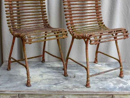 Pair of antique French Arras garden chairs with scrolled edges Online now