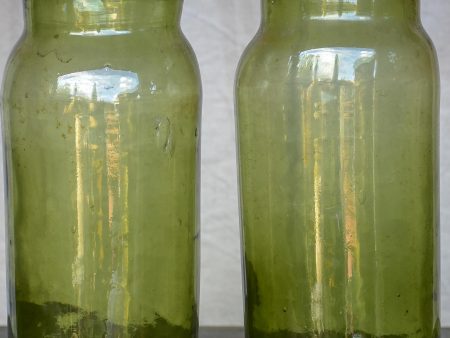 A pair of large late 19th Century green glass jars Discount