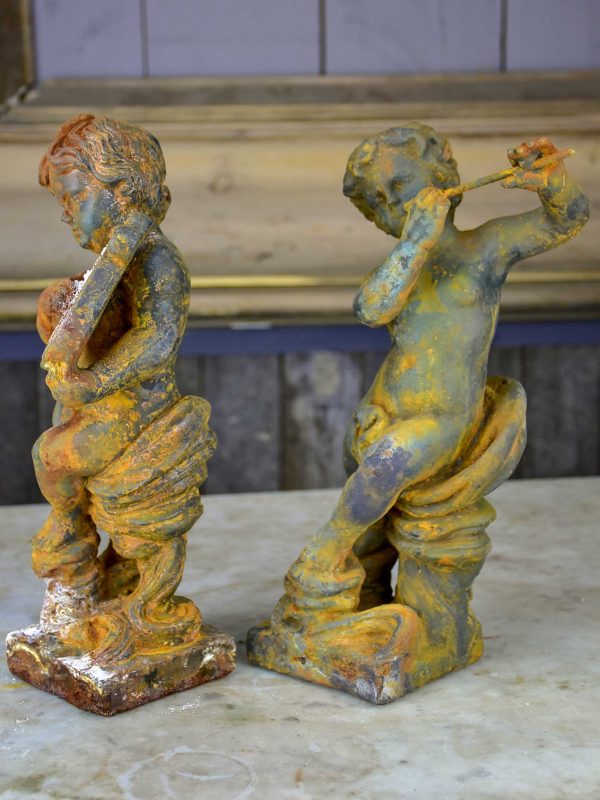 Two antique cast iron cherubs playing musical instruments Cheap