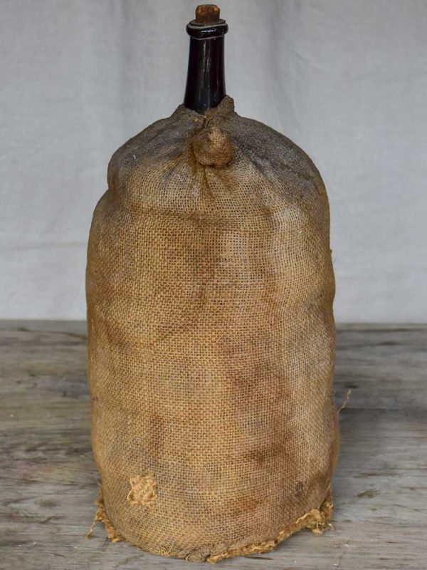 Antique French carboy in jute Supply